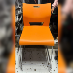 Vibrant Orange Plastic Chair with Chrome Sled Base – Modern and Durable Design