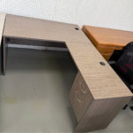 Modern L-Shaped Office Desk with Drawers – Gray Woodgrain Finish and Cable Ports